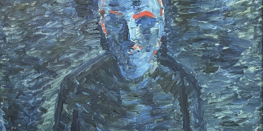 Man i the dark with red details.